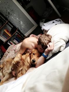 Boy, sleeping with a Golden Retriever Boy, sleeping with a Golden Retriever